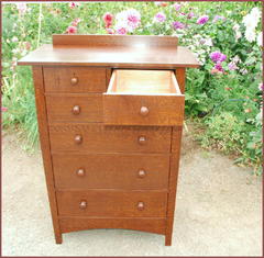 Shown with one drawer fully extended.  We build drawers with the option of traditional drawers with wooden center guides under the drawers or high quality contemporary full extention ball bearing slides, rated for extra heavy weight loads. Some collectors prefer the appearance and authenticity of traditional drawers while others prefer the convenience of a drawer that fully extends and the ease of the ball bearing slides when using the drawer.